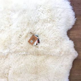 large rug of white sheepskins